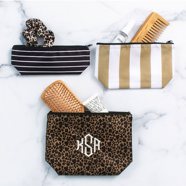 monogrammed packable cosmetic bag in Leopard with hair supplies