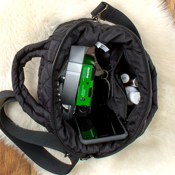 inside of black diamond quilted crossbody showing zipper pocket