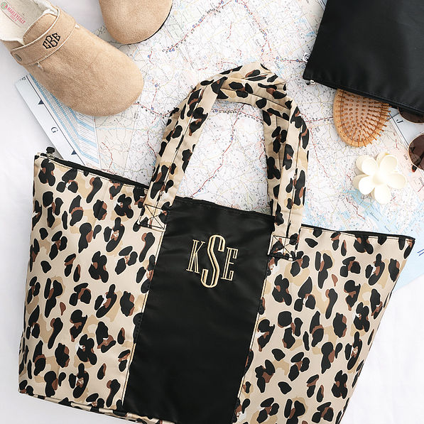 classic cheetah packable duffel on map