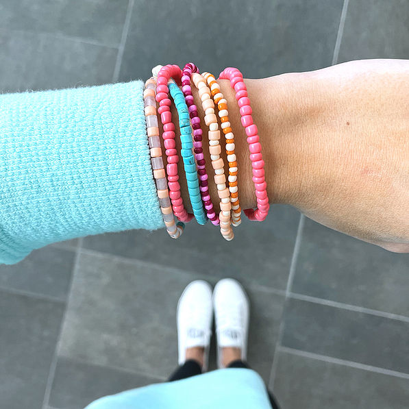 pink twisted bead bracelet on wrist- ootd