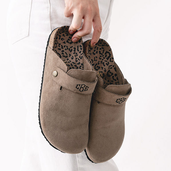 mocha monogrammed clogs in hands