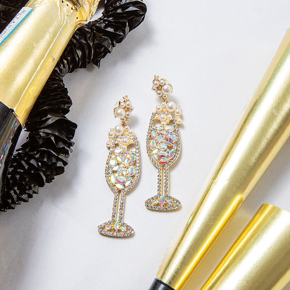 gold sparkle champagne earring with party supplies
