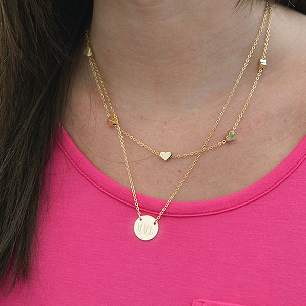 gold layered heart necklace on brunette