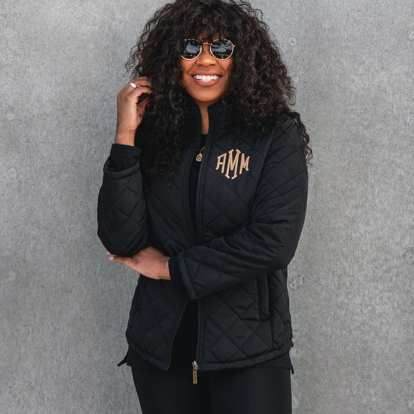 monogrammed black puffer quilted jacket with leggings and sunglasses