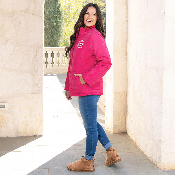 side of hot pink puffer monogrammed jacket