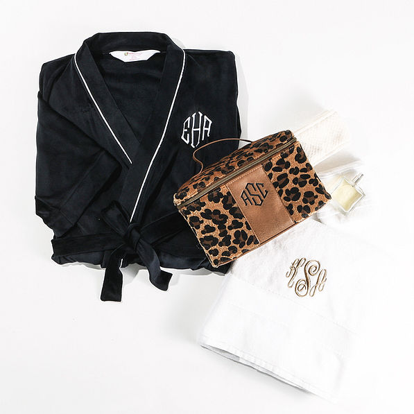 leopard train case with robe and towel flatlay