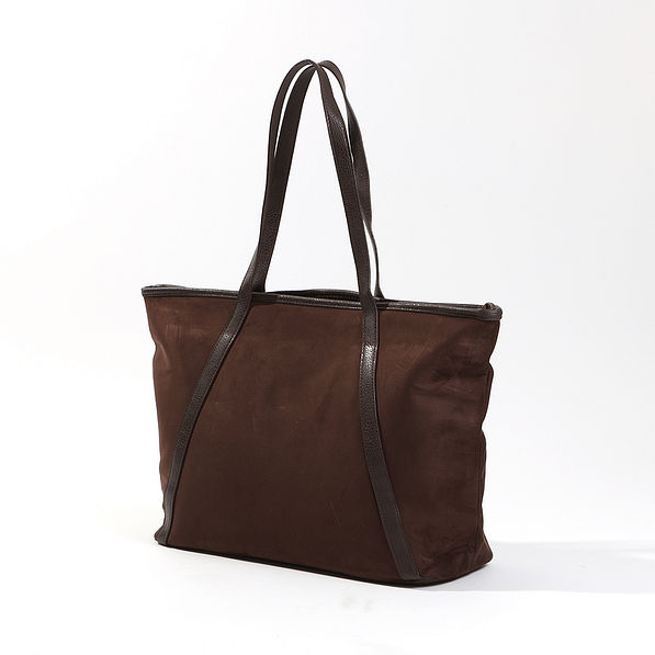angled stuido shot of the suede tote