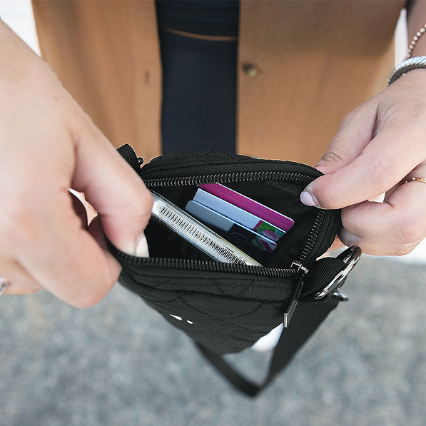 inside of black quilted phone crossbody