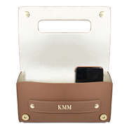 open flap of tan monogrammed clutch