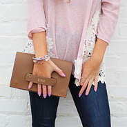 brown foil stamped clutch with pink sweater