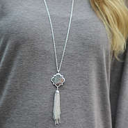 custom silver quatrefoil tassel necklace gray shirt