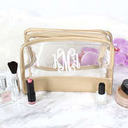 clear make up bag with white monogram and gold detailing