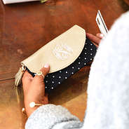 black and white polkadot personalized wallet with gold detail