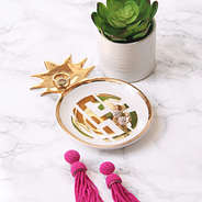 pineapple tray holding earrings on counter