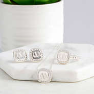 Dainty stylish jewelry with monogram and halo of rhinestones