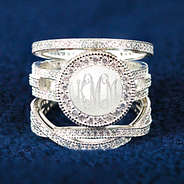 engraved pave rhinestone ring stack on blue background