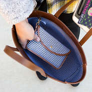 Matching gingham pouch clipped into inside lining of leather tote