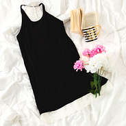 Black Lace Sleep Gown on Bed with Book and Flowers