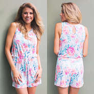 girl wearing a floral Monogrammed Romper