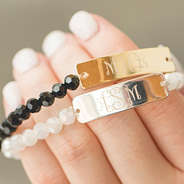 close up of monogrammed beaded bracelets