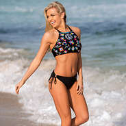 girl playing in waves wearing a Monogrammed Mexicali High Neck Bikini Top