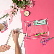 monogrammed acrylic tray on pink and white paper