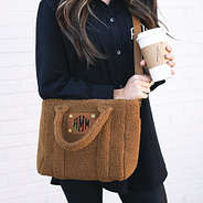 close up of sherpa crossbody bag over shoulder