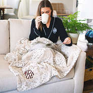 monogrammed fur netural spotted blanket