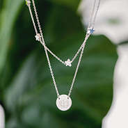silver star necklace with plant
