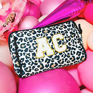 Large Letter in White on neoprene cosmetic case in ivory leopard with balloons