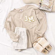 large letter patches on casual sweatshirt