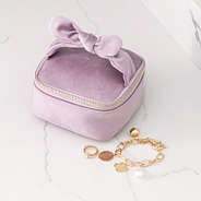 mauve bow travel jewelry case up close
