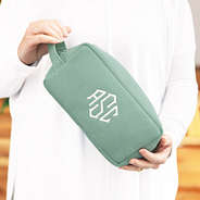 girl holding monogrammed corded cosmetic bag