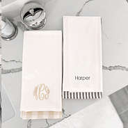 monogrammed hand towel set in both colors on marble
