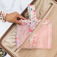 coral floral monogrammed packable laundry bag in luggage