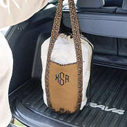 monogrammed leopard packable laundry bag in trunk of car