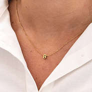 diy letter charm necklace with b charm on neck