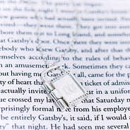 Monogrammed Keepsake Locket closeup on book page
