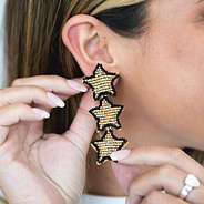 star earring on ear