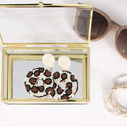 leopard earrings inside of jewelry box