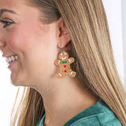 gingerbread man earrings in ears