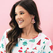 pink beaded christmas tree earring in ear