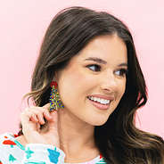 beaded christmas earrings in green worn by girl