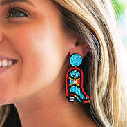 cowboy boot earrings on ear