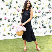 girl wearing black tank midi dress with flowers