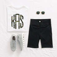 crossover bike shorts outfit on bed with personalized shirt