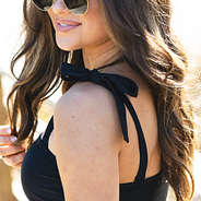 up close of black one piece bathing suit strap