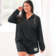 athletic shorts on plus size model with mirror silver monogram