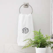 white hand towel hanging up