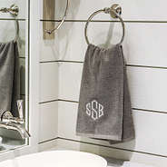 grey hand towel on towel holder